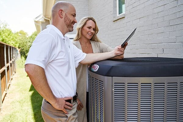 Lennox Technician Showing Homeowner New System