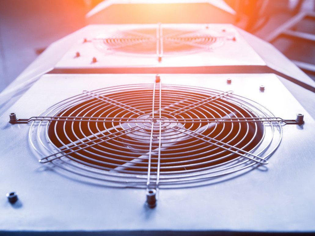 Close up of a fan grille on an AC Unit